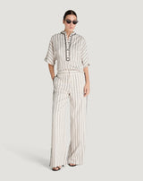 Pantaloni in viscosa fluida con fantasia a righe