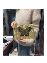 Pochette con manico ricamata a mano