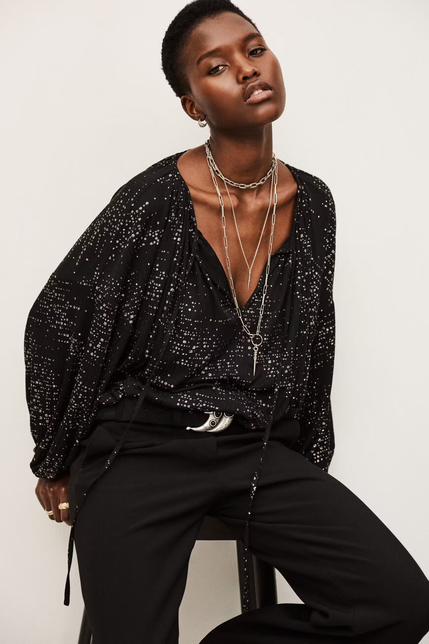 Blusa con brillantini