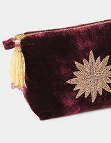 Pochette con ricamo oroa forma di stella