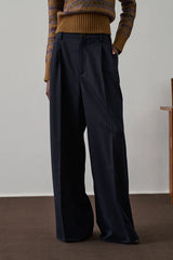 Pantaloni con piega in gabardine di lana