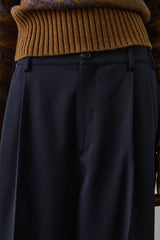 Pantaloni con piega in gabardine di lana