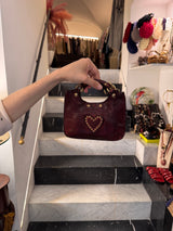 Borsa tracolla mini "LUIGIA Poggibonsi" in pelle di vacchetta laminata tinta in capo con borchie vinaccia - Campomaggi